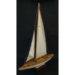 A 25'' Pond Yacht with stand. Having white painted wooden hull with lead weighted keel, brass