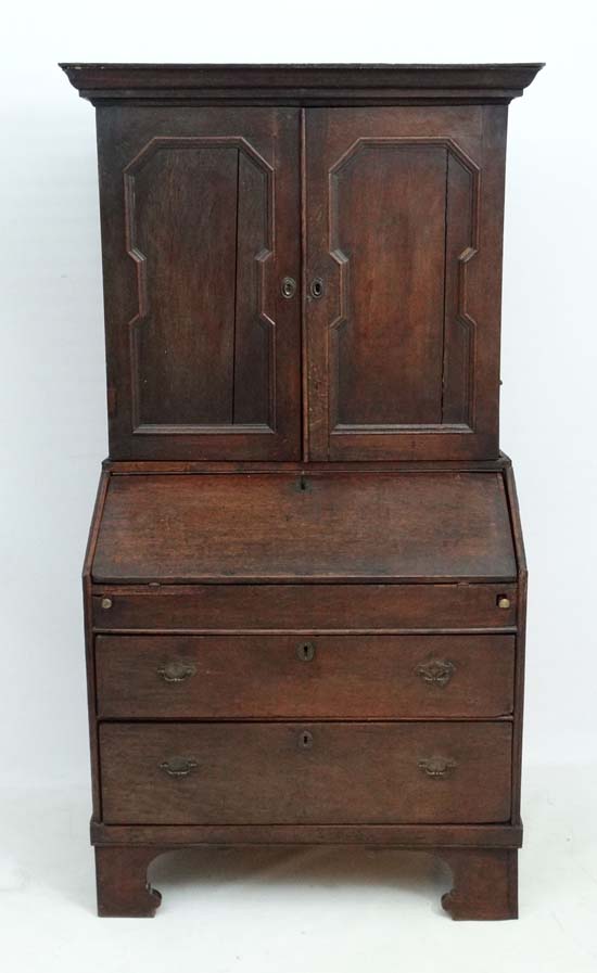 An 18thC George I country made oak bureau bookcase with hinged well section. 37" wide x 71" high x - Image 5 of 7