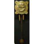 Arts and Crafts : a Scottish Glasgow School brass hanging wall clock striking on a coiled gong, with