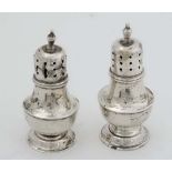 A pair of silver pepperettes hallmarked Birmingham 1911 maker E.S Barnsley & Co. (32g) CONDITION: