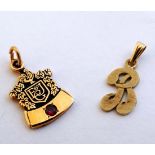 2 gold pendant charms one 10k monogrammed to front F& JG and set with a ruby, the other 'R' and