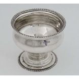 A Victorian silver pedestal sugar with gardrooned decoration and hallmarked  London 1938. 3 1/4"