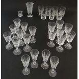 Waterford Crystal : a collection of 24 assorted drinking glasses and two vases  .

 CONDITION: