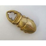 A novelty brass vesta case in the form of a stag beetle. 2 1/2" long  CONDITION: Please Note -  we