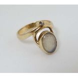 A 14k gold ring set with diamond and moonstone cabochon  CONDITION: Please Note -  we do not make