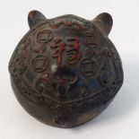 An oriental good luck SEED PODcharm in the form of a carved Pig's head decorated with bats, script