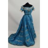 A Victorian ladies blue silk dress and jacket with lace trim and embroidery detail to skirt and