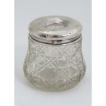 A cut glass hair tidy pot with silver top Hallmarked London 1912 maker Robert Pringle & Sons. 2 3/4"