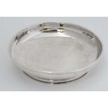 A silver pin dish on circular foot. Hallmarked Birmingham 1937 4" diameter (50g) CONDITION: Please