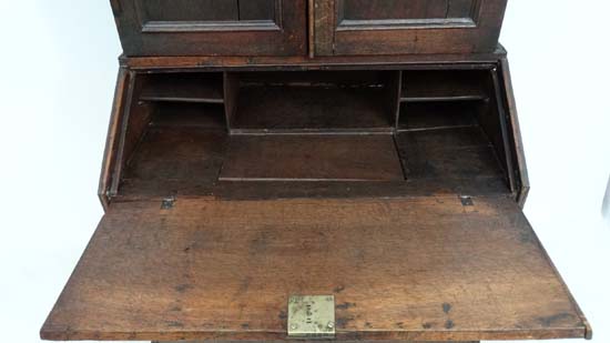 An 18thC George I country made oak bureau bookcase with hinged well section. 37" wide x 71" high x - Image 6 of 7