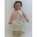 A late 19thC / early 20thC Bisque-head German doll by Simon & Halbig with blue sleeping glass