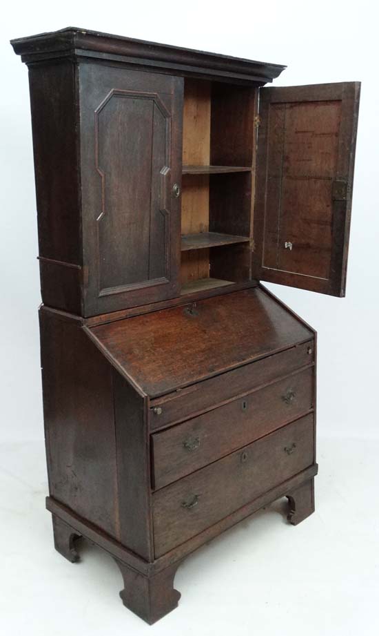 An 18thC George I country made oak bureau bookcase with hinged well section. 37" wide x 71" high x - Image 3 of 7