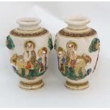 A Pair of hand painted Japanese Satsuma style Moriage Baluster vases, decorated in high relief