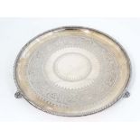 A Victorian large silver plate tray of circular form with engraved decoration. By Elkington & Co.