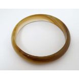 An agate hardstone bangle formed bracelet  CONDITION: Please Note -  we do not make reference to the