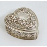 A silver dressing table pot of heart form with hinged lid and gilded interior. Hallmarked  London