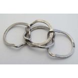 A .800 white metal puzzle ring / Turkish wedding ring formed as 4 conjoined bands  CONDITION: Please