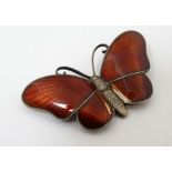 Norwegian Silver : A silver gilt brooch formed as a butterfly with red guilloché enamel decoration.