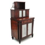 A Regency English Bonheur de Jour amboyna and mahogany cross banded writing cabinet with book case