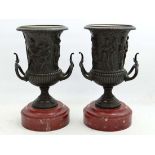 Claude Michel Clodion (1738-1814), A pair of Patinated bronze campana urns depicting classical