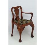 A 1930s burr walnut musicians chair with flattened open arms 32" high CONDITION: Please Note -  we