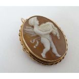 An oval cameo brooch / pedant having image of a classical cherub to centre within a gilt metal