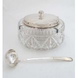 A silver plate and cut glass punch? bowl with central lidded section and ladle. approx 10" wide