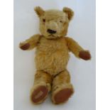 A mid 20thC Hygienic Toys by Chad Valley Co ltd '' Teddy Bear '' . Having golden plush, jointed