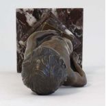 A cast Bronze  of the " Manneken Pis " Bruges. Mounted upon a stepped marron marble like base.