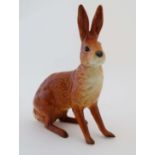 A rare Beswick tan seated hare, model number 1025, bears factory stamp and impressed marks to base.