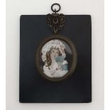 A 19thC oval miniature, 
Watercolour and gouache on ivory,
A young girl holding a fan.
With brass