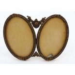 A twin oval miniature / photograph frame with easel back. Approx  3 3/4" high x 5" wide