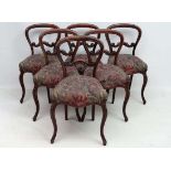 A Victorian set of 6 Rosewood balloon back dining chairs with overstuffed seats and cabriole front