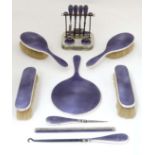 An impressive silver and purple guilloché enamel dressing table set comprising 4 brushes (2+2), hand