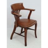A c.1900 oak office chair with lathe back splat, open arms and upholstered seat 33" high  CONDITION: