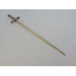 A silver plated meat skewer/ letter opener in the form of miniature sword. 12" long  CONDITION: