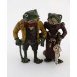 A polychrome cold painted bronze novelty figure group formed as a pair of frogs in Victorian