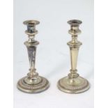 A pair of  late 19thC / early 20thC silver plate candlesticks with gadrooned decoration  10 1/2"