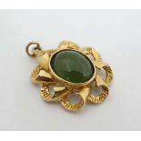 A gilt metal pendant set with green stone cabochon to centre 1" long  CONDITION: Please Note -  we