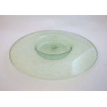 Early 20 th C : a circa 1930s large green glass dish with stepped foot,  approx. 14" diameter