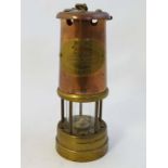 Davy lamp: A copper and brass miners safety lamp 'The British coal Mining Co. Wales Type Vale'