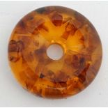 *Withdrawn* An amber model of an egg with pollen inclusions on a circular stand 2 3/4" high