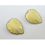 Norwegian Silver : A pair of silver gilt clip earrings formed as  leaves with yellow guilloché