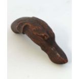 A c.1900 novelty stick / cane handle in the form of a long dog 4" long  CONDITION: Please Note -  we