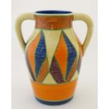 An c1930 Clarice Cliff '' Bizarre '' Range twin handled '' geometric '' pattern lotus jug. Hand