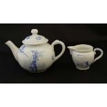 A late 19thC miniature / child's blue and white tea pot and cover and milk jug, decorated with