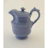 A c1840 pale blue moulded Staffordshire jug, having stylised floral decoration. 6 1/4'' high.