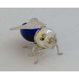 A 20thC silver plate and blue glass novelty honey pot formed as stylized bee 5 3/4" long  CONDITION: