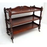 A William IV mahogany 3-tier buffet with twin baluster turned supports and casters 51 1/4" wide x 19