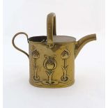 Art Nouveau : A Joseph Sankey & Sons Birmingham brass hot water can with embossed decoration and